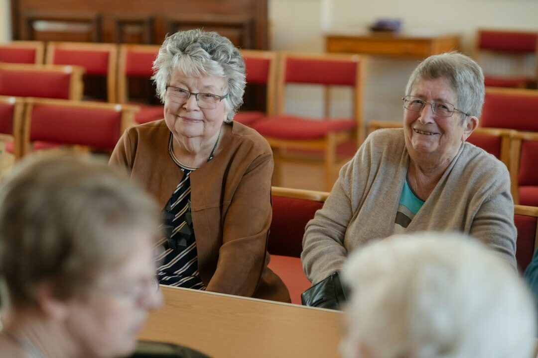 elderly friends chatting